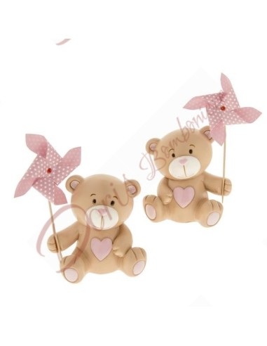 Teddy bear piggy bank favors for baby girl baptism with pink pinwheel