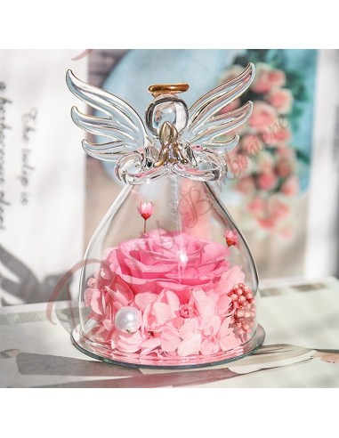 Pink favors and pink flowers stabilized inside a blown glass angel h 10.5 cm