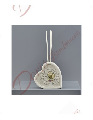 First communion perfumer favors with sacred symbol in the shape of a heart with tree of life