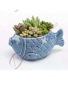 Das Meeresthema bevorzugt kleine Fische aus glänzender blauer Keramik, ideal als Pflanzenhalter