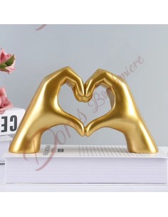 Modern and elegant design wedding favor hands forming a heart in gold color