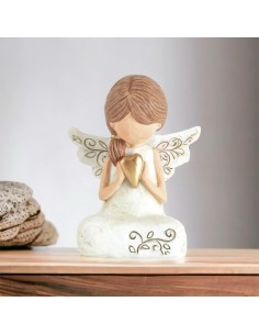 First communion favor girl angel sitting with gold heart in her hands in handcrafted resin