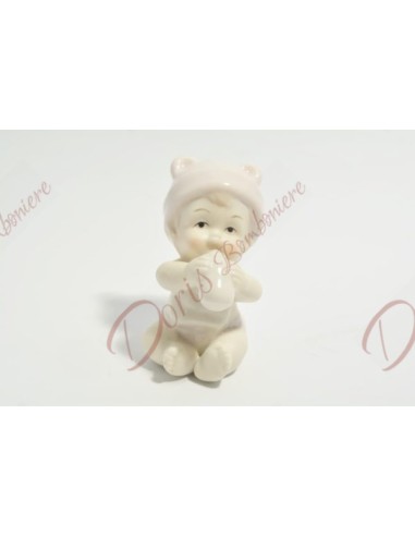 Petite fille en porcelaine avec détails roses, h 8 x ∅ 8,5 cm