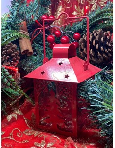 Metal and glass lantern with red christmas tree